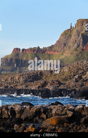 Giant's Causeway with Chimney Stacks, Causeway Coast, County Antrim, Northern Ireland, United Kingdom, Europe Stock Photo