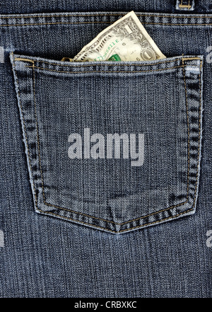 Crumpled 1 US dollar bill in a jeans pocket Stock Photo