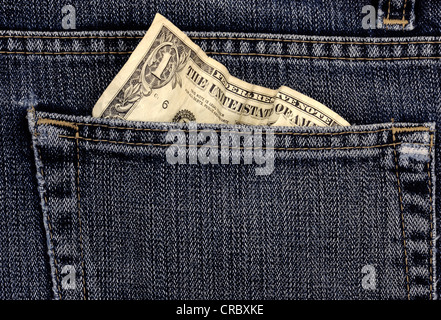 Crumpled 1 US dollar bill in a jeans pocket Stock Photo