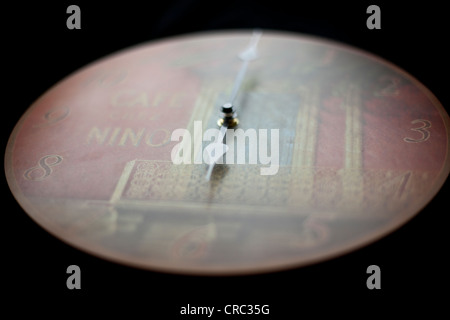 Clock at six O'clock on black background, London, England, UK Stock Photo
