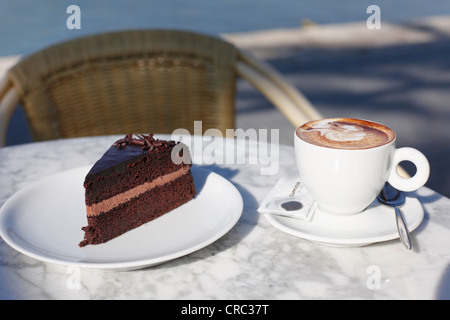 A chocolate gateau and a cappuccino, Port d'Andratx harbour, Majorca, Mallorca, Balearic Islands, Spain, Europe Stock Photo