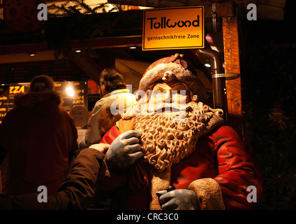 Tollwood winter festival, Santa Claus and a sign, GMO-free zone, Theresienwiese, Munich, Bavaria, Germany, Europe Stock Photo