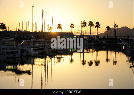Sunrise, boats in the harbour, marina of Puerto de Pollensa, Port de Pollenca, Majorca, Balearic Islands, Mediterranean Sea Stock Photo