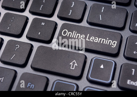 online learning concepts, with message on enter key of keyboard. Stock Photo