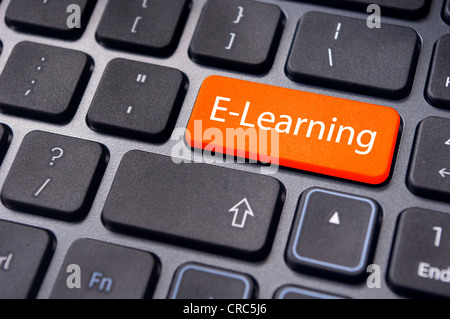 Concepts of E-learning, for computer based learning, with a message on enter key of keyboard. Stock Photo