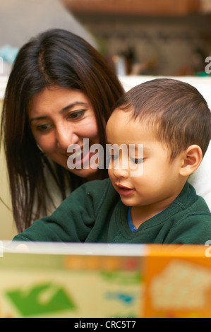 Mother and son using computer Stock Photo