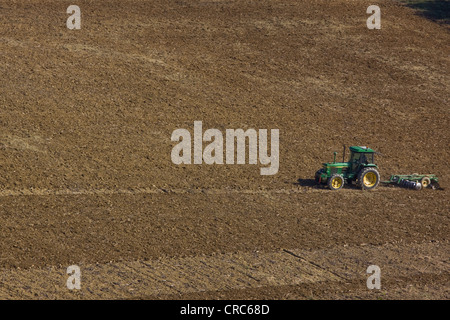 A farmer prepares arable land to lie fallow after the harvest in SW France Stock Photo