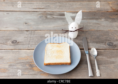 Rabbit decoration and plate of toast Stock Photo