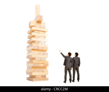 business concept. businessman watching the tower by building block Stock Photo