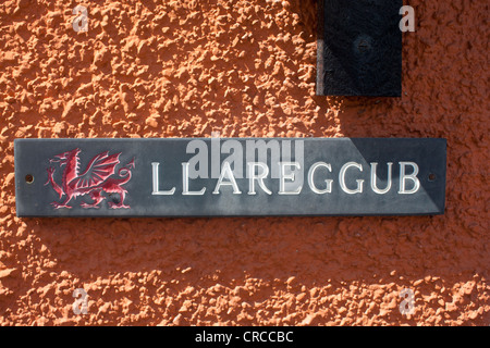 'Llareggub' slate name plate with red Welsh dragon on exterior of house in New Quay Ceredigion Cardigan Bay Mid Wales UK Stock Photo