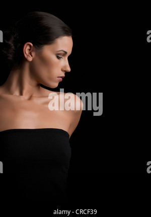 Woman looking over her shoulder Stock Photo