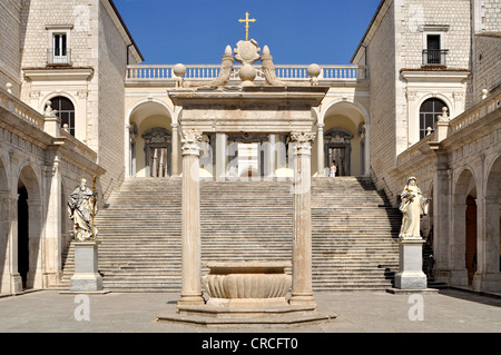 Cistern and statues of St. Benedict and St. Scholastica in the Cloister of Bramante, Benedictine abbey of Montecassino Stock Photo