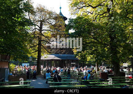 People sitting in the beer garden near the Chinese Tower in the English Garden, Munich, Bavaria, German, Europe Stock Photo