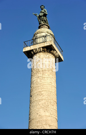 Trajan's Column with war depictions in relief band and with bronze statue of the apostle Peter, Trajan's Forum Stock Photo