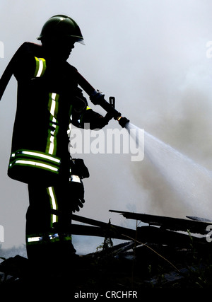 firefighter in full activity, Germany Stock Photo