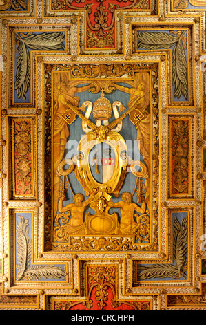 Coat of arms of Pope Gregory XVI. on the wooden coffered ceiling of the Basilica of San Sebastiano fuori le mura above the Stock Photo