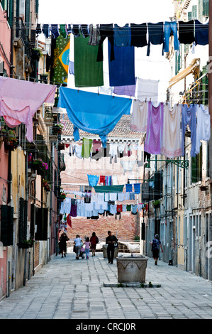 Laundry drying on clotheslines stretched across the street, Castello, Venice, Italy, Europe Stock Photo