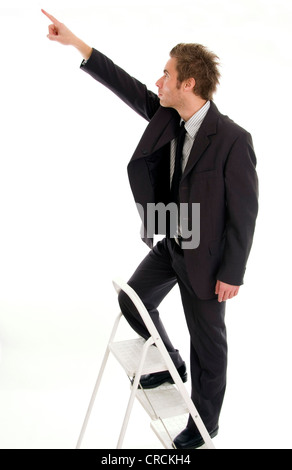 young businessman on job ladder Stock Photo