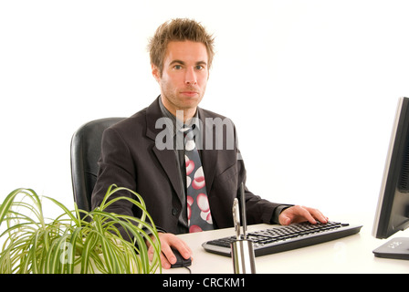 young businessman in his office, working at the computer Stock Photo