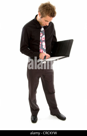 young businessman in a black outfit, making some notes Stock Photo