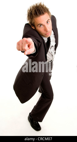 young businessman with suit and tie points to something Stock Photo