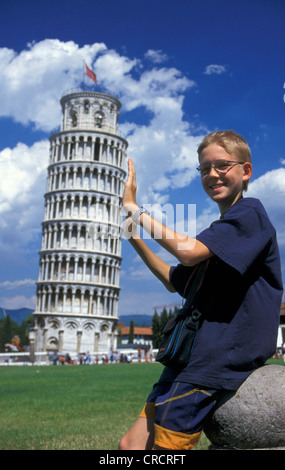 a boy supporting the Leaning Tower of Pisa, Italy, Pisa Stock Photo
