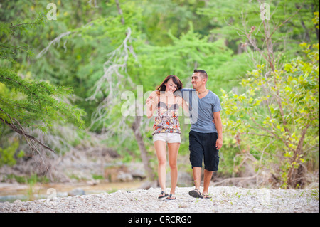 Young couple in love - man, 22, hispanic, woman, 20, korean, location natural environment near Leakey, Texas, USA Stock Photo