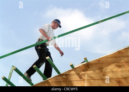 Carpenter to build a roof truss Stock Photo