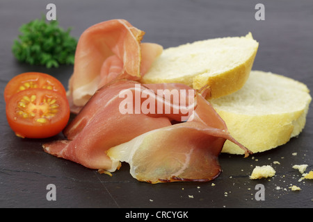 Black Forest ham with slices of baguette Stock Photo