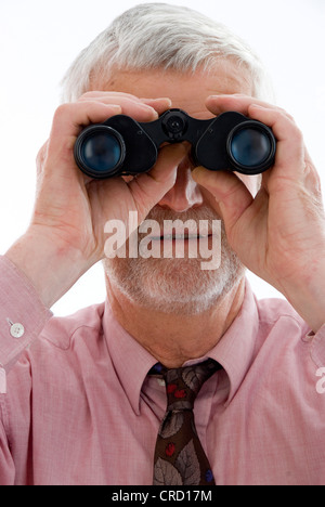 retiree with spyglass Stock Photo