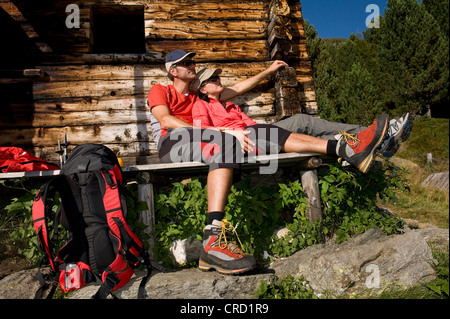 Two hikers having a break, Dolomites, South Tyrol, Italy Stock Photo