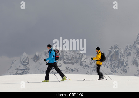 Two ski mountaineers in the Dolomites in winter, Italy Stock Photo