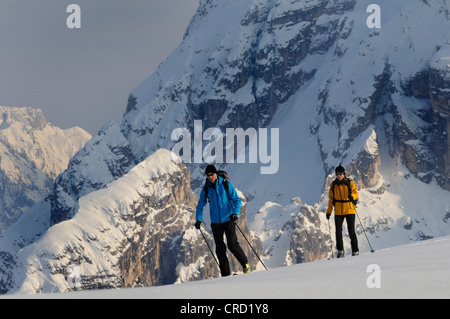 Two ski mountaineers in the Dolomites in winter, Italy Stock Photo