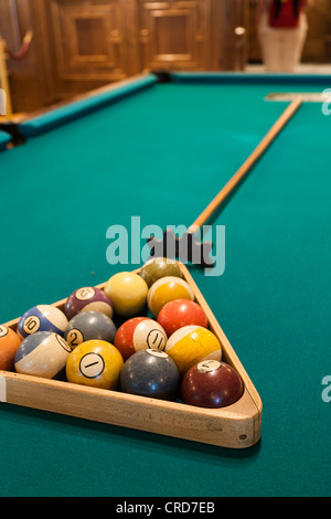 Ready to Break.  Numbered old billiard balls racked up and ready to break. Stock Photo