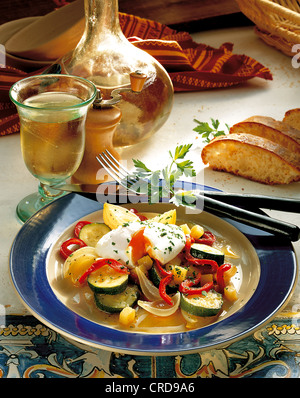 Soft boiled eggs on onion vegetables, vegetarian stew, Portugal. Stock Photo