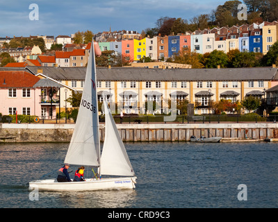 Small sailing boat in Bristol Docks and Harbour area in the city centre England UK which has been extensively redeveloped Stock Photo