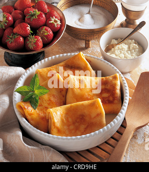 Pancake parcels will with fresh strawberries and cream cheese, Israel. Stock Photo