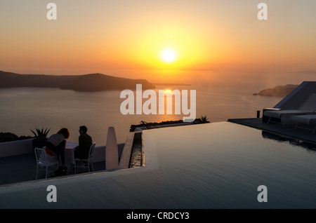 Couple enjoying the sunset Santorini Greece Stock Photo