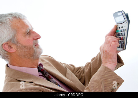 older businessman with pocket calculator Stock Photo
