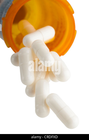 Pills falling out of prescription bottle Stock Photo