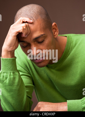 Young man, dark-skinned, with closed eyes, pensive, portrait Stock Photo