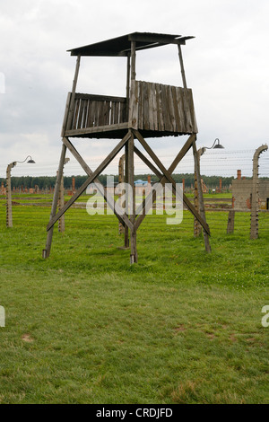 Fence and guard tower in the concentration camp, Auschwitz-Birkenau, Poland, Europe Stock Photo