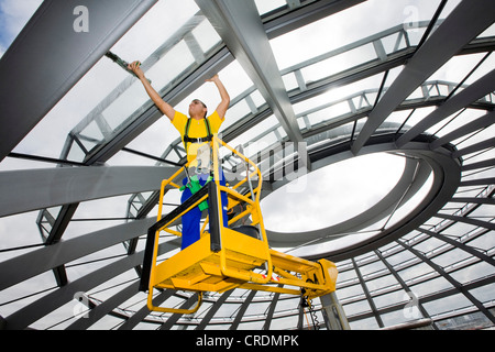 Window cleaner cleaning the dome of the Reichstag Building, Deutscher Bundestag, German parliament, Berlin, Germany, Europe Stock Photo