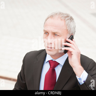 Businessman with mobile phone Stock Photo