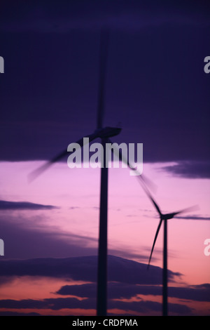wind turbines in front of evening sky Stock Photo