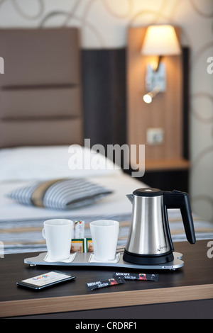 A courtesy tray in a hotel room (France).  Tea and coffee making facilities in a hotel room. Hospitality tray. Stock Photo