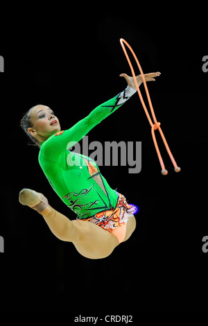 woman doing rhythmic gymnastics with rope Stock Photo