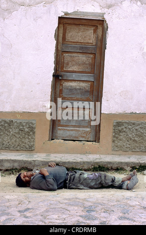 Drunk sleeping on the street in Ayacucho, Peru. Stock Photo