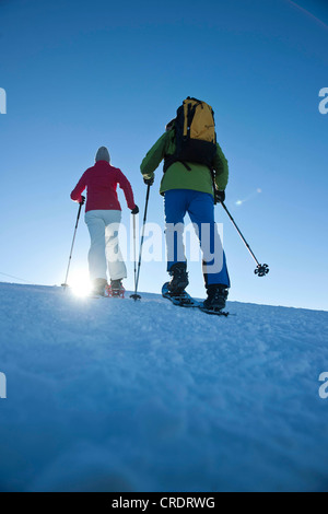 Snowshoeing in the mountains Stock Photo