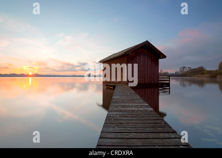 Sunrise with fishing lodge and light morning mist near Rimsting on Chiemsee Lake, Bavaria, Germany, Europe, PublicGround Stock Photo